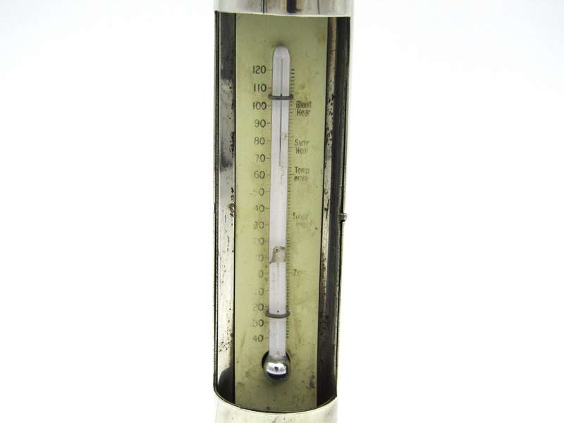 Sterling silver thermometer with swivelling case.