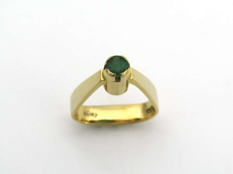 18K gold emerald ring by Erich Frey.