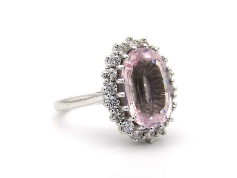 18K gold morganite and diamond halo ring.