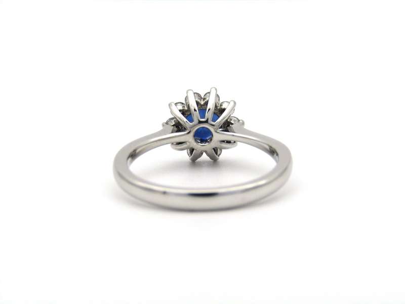 18K gold sapphire and diamond halo ring.