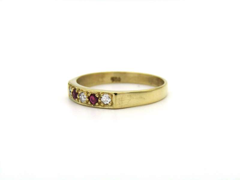 18K gold diamond and ruby ring.