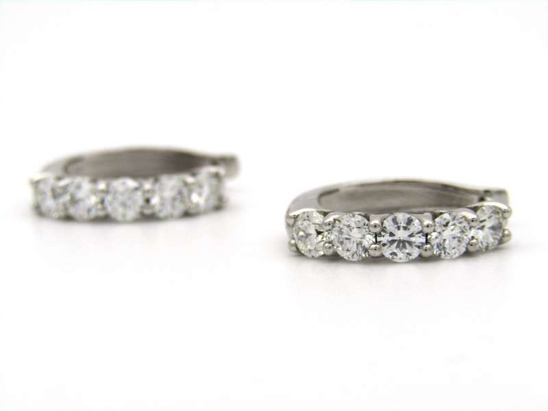 18K gold Diamond Protea huggie earrings by Browns.