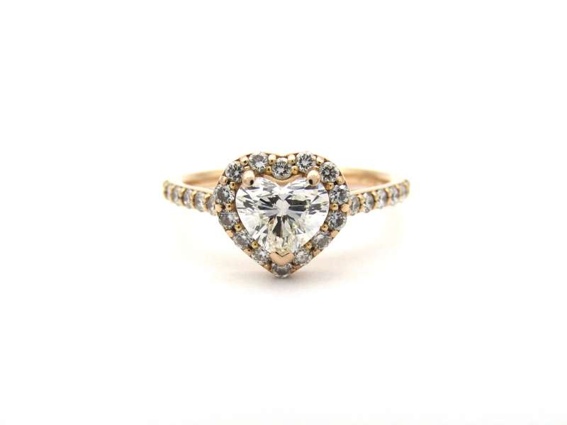18K gold heart-shaped diamond halo ring.
