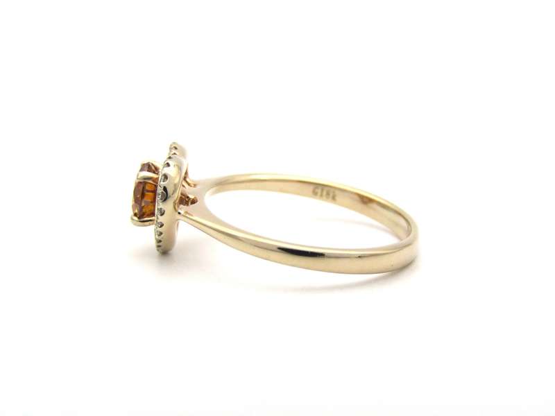 18K gold Orange diamond halo ring.
