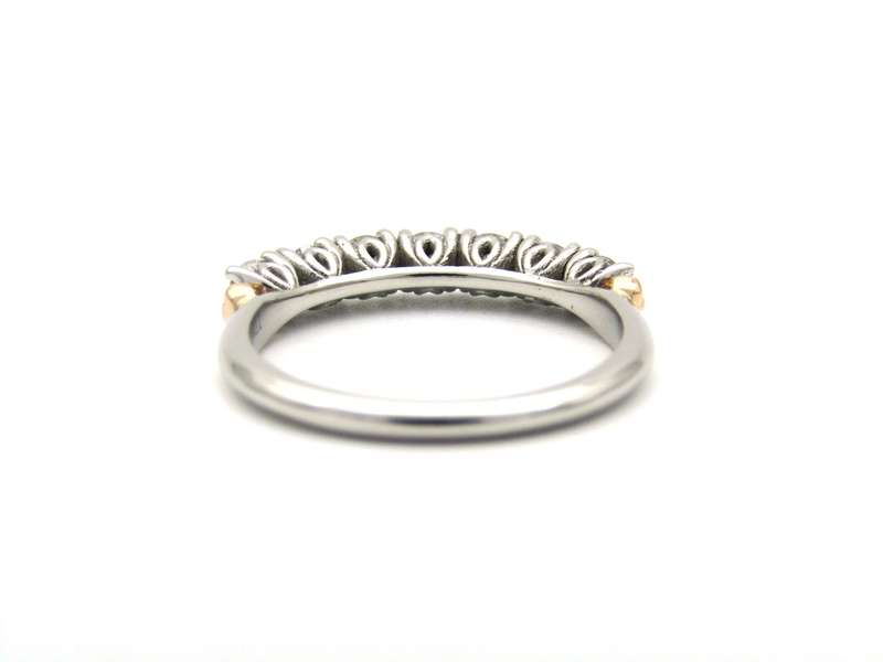 Platinum and 18K gold diamond Protea half eternity ring by Browns.