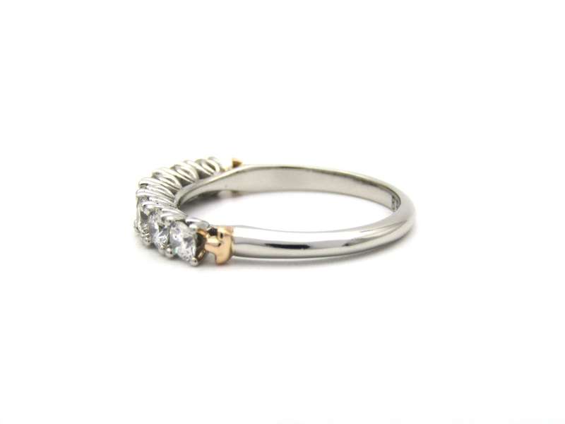 Platinum and 18K gold diamond Protea half eternity ring by Browns.