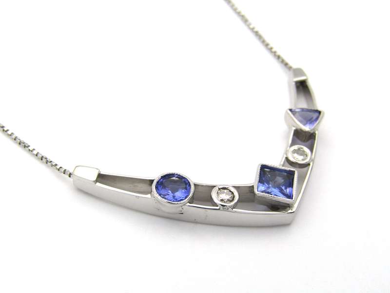 18K gold tanzanite and diamond necklace.