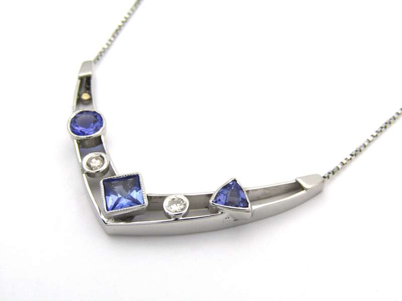 18K gold tanzanite and diamond necklace.