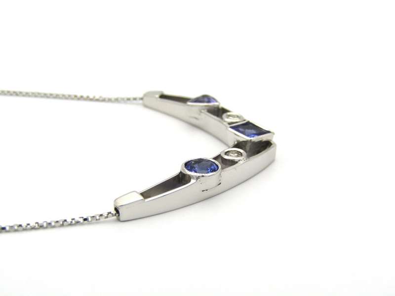 18K gold tanzanite and diamond necklace.