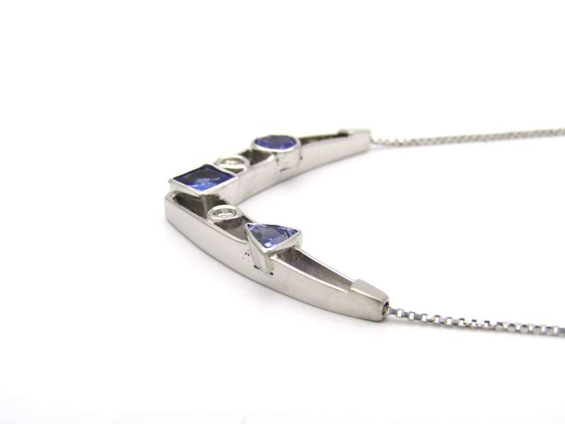 18K gold tanzanite and diamond necklace.