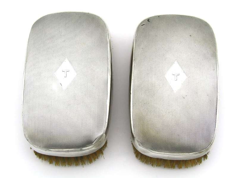 A pair of silver clothes brushes by Charles Packer & Co, London, 1929.