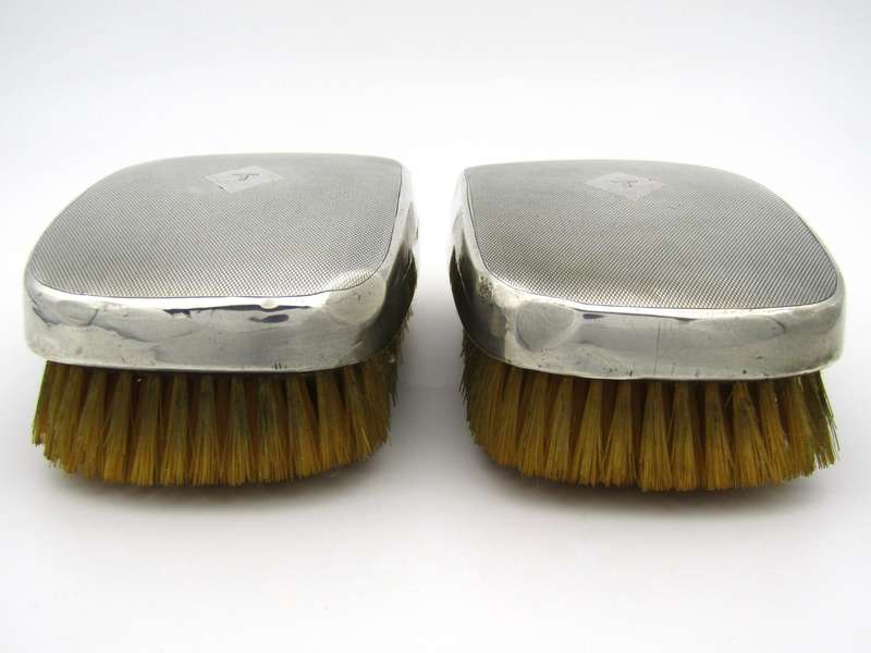 A pair of silver clothes brushes by Charles Packer & Co, London, 1929.