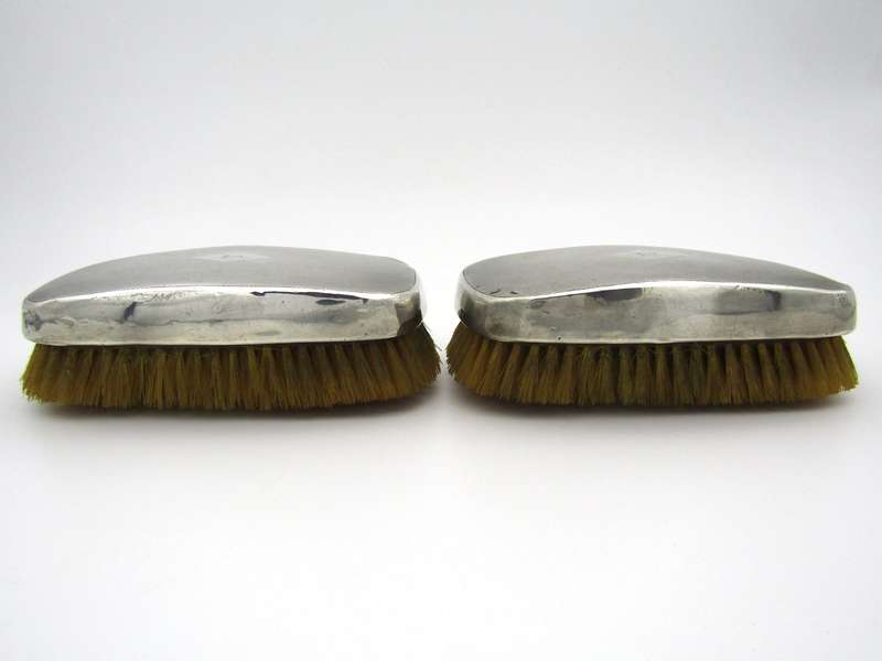 A pair of silver clothes brushes by Charles Packer & Co, London, 1929.