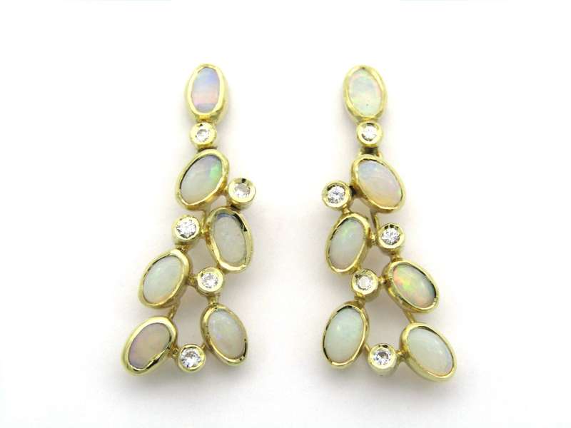 14K gold opal and diamond drop earrings.