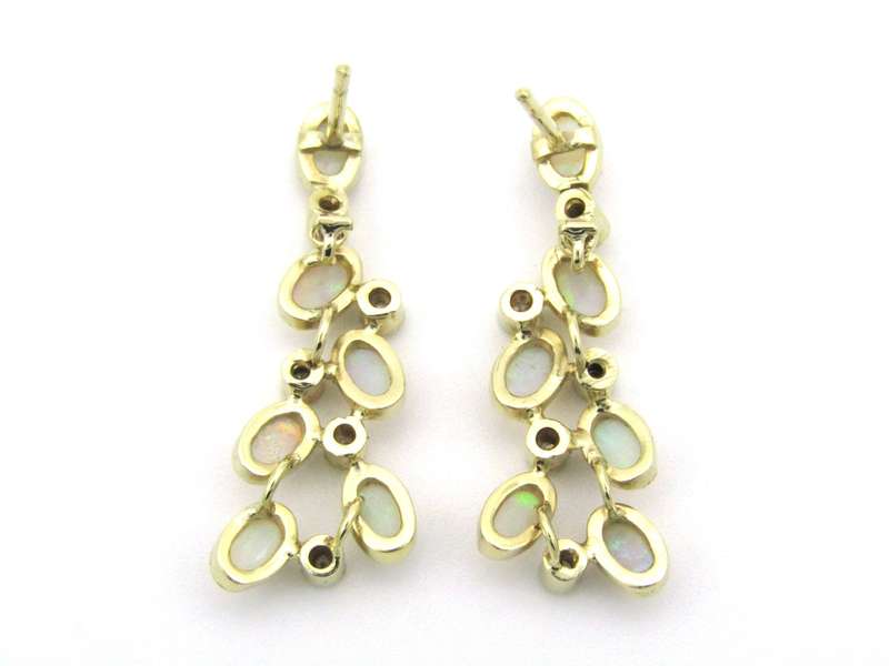 14K gold opal and diamond drop earrings.