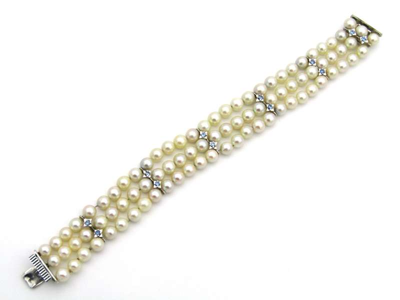 18K gold three-strand akoya cultured pearl bracelet, circa 1980's.