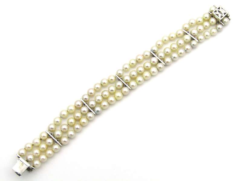 18K gold three-strand akoya cultured pearl bracelet, circa 1980's.