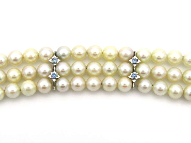 18K gold three-strand akoya cultured pearl bracelet, circa 1980's.