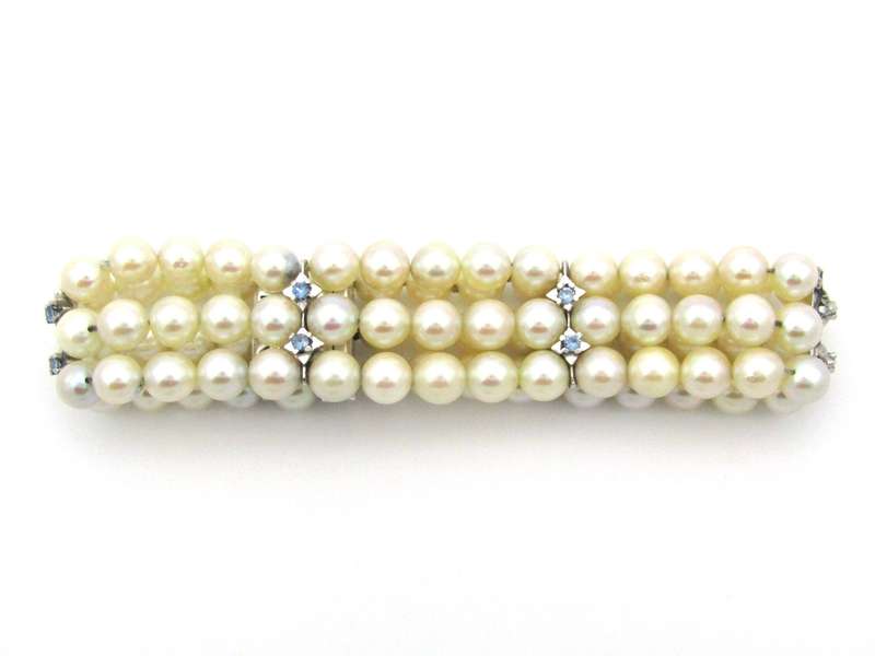 18K gold three-strand akoya cultured pearl bracelet, circa 1980's.