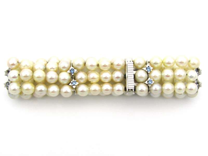 18K gold three-strand akoya cultured pearl bracelet, circa 1980's.