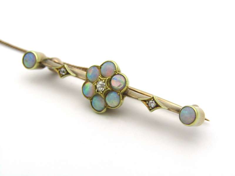 Edwardian 9K gold opal and diamond bar brooch, Circa 1905.
