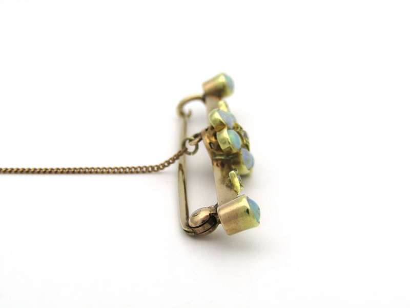 Edwardian 9K gold opal and diamond bar brooch, Circa 1905.