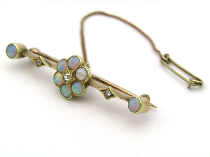 Edwardian 9K gold opal and diamond bar brooch, Circa 1905.