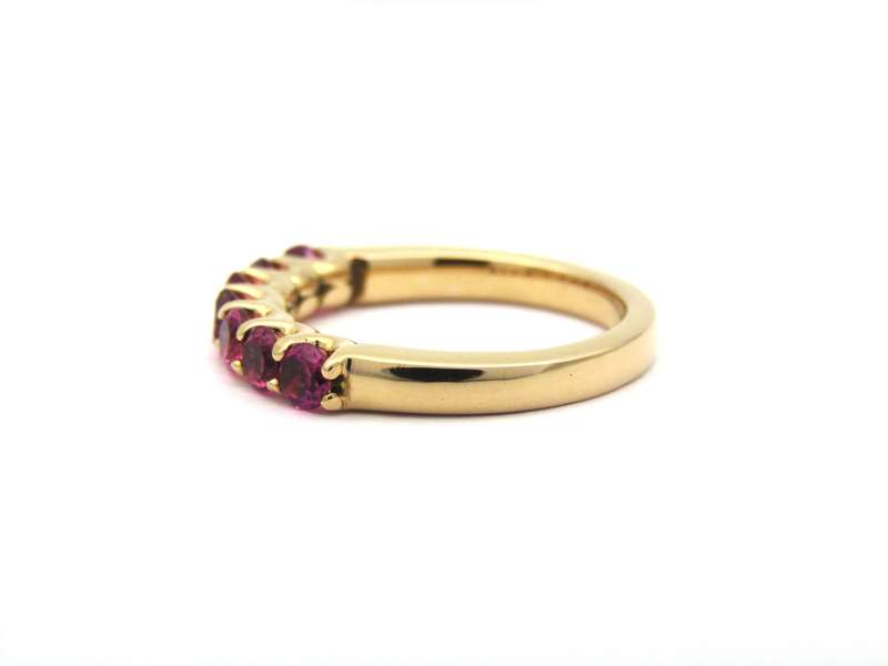18K gold pink tourmaline half eternity ring by Jack Friedman.