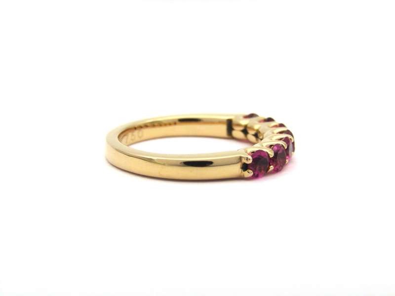 18K gold pink tourmaline half eternity ring by Jack Friedman.