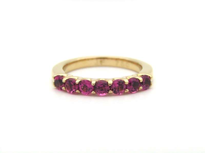 18K gold pink tourmaline half eternity ring by Jack Friedman.