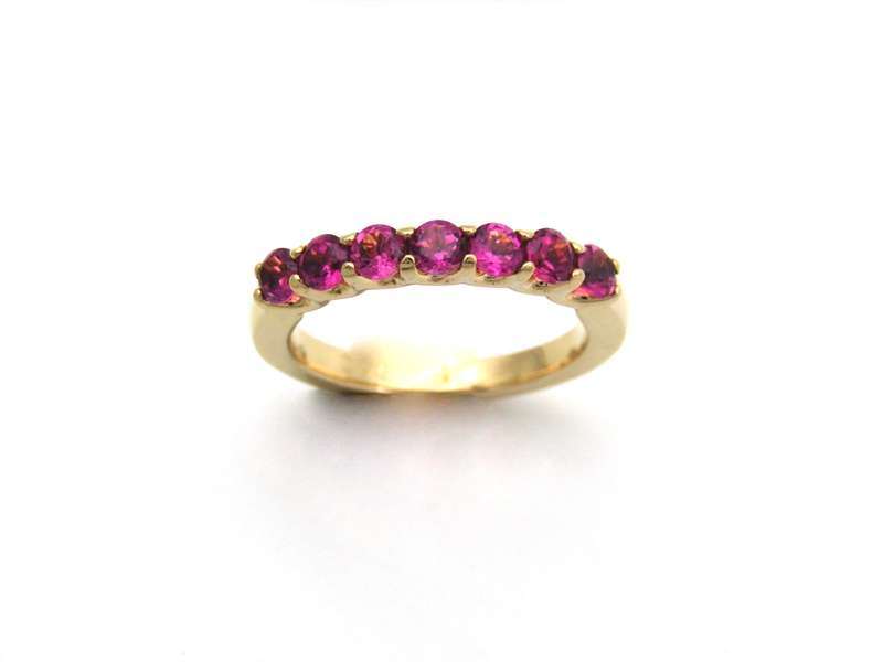 18K gold pink tourmaline half eternity ring by Jack Friedman.