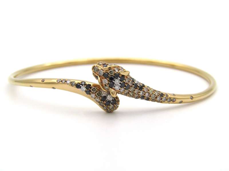 18K gold ruby and diamond leopard bangle.