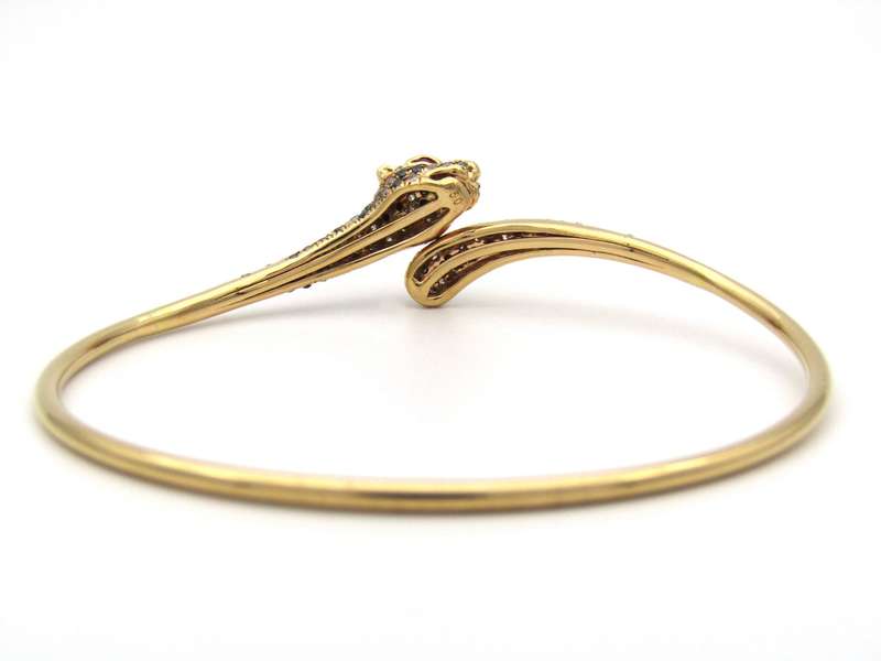 18K gold ruby and diamond leopard bangle.
