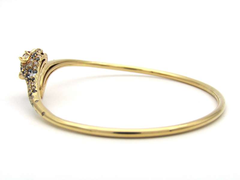 18K gold ruby and diamond leopard bangle.