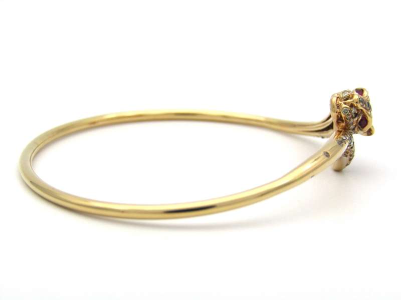 18K gold ruby and diamond leopard bangle.