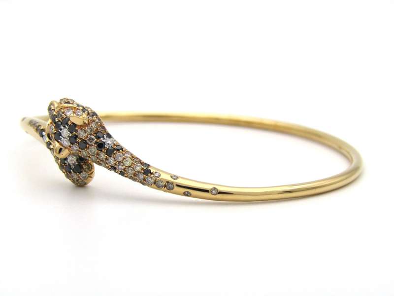 18K gold ruby and diamond leopard bangle.