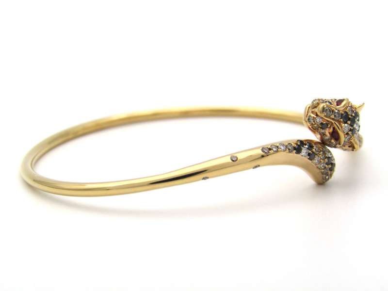18K gold ruby and diamond leopard bangle.