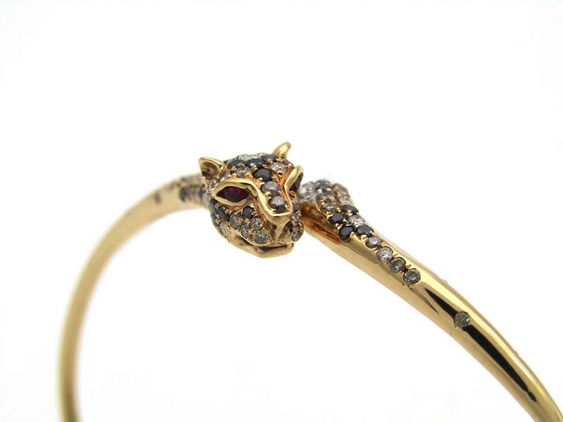 18K gold ruby and diamond leopard bangle.