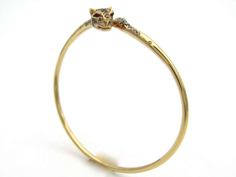 18K gold ruby and diamond leopard bangle.