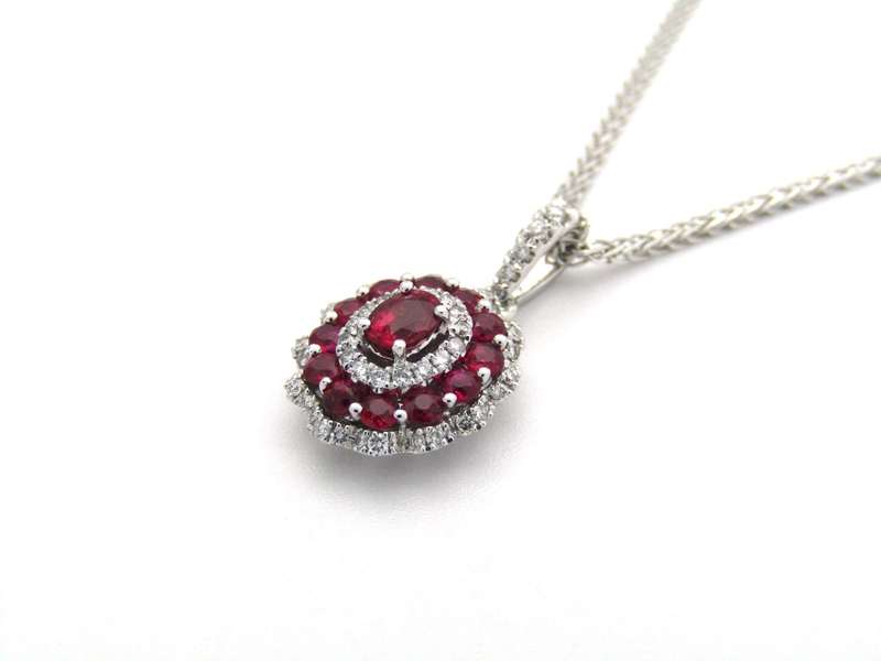 18K gold ruby and diamond pendant.