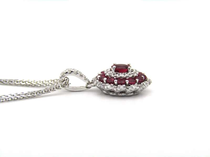 18K gold ruby and diamond pendant.