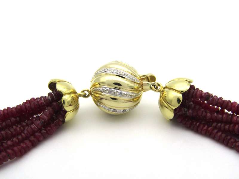 14K gold diamond and 7-strand ruby necklace.