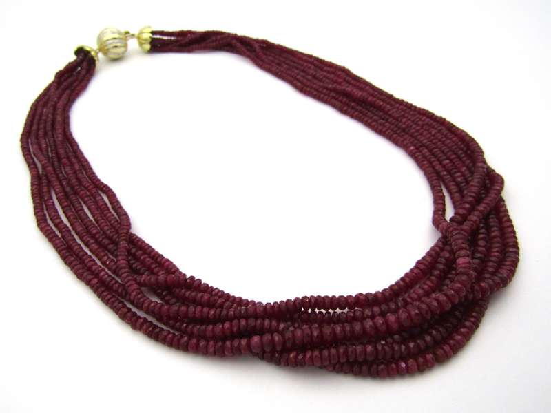 14K gold diamond and 7-strand ruby necklace.