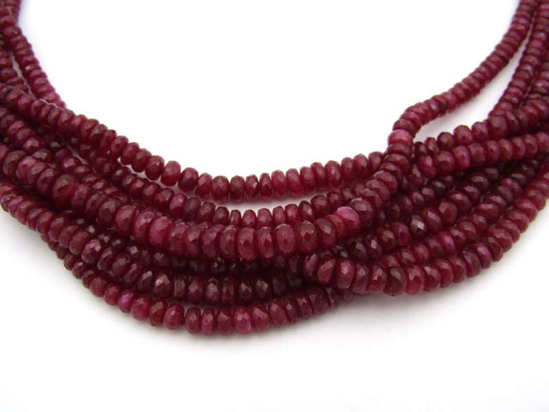 14K gold diamond and 7-strand ruby necklace.