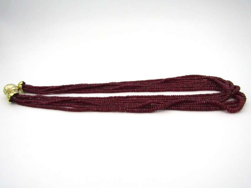 14K gold diamond and 7-strand ruby necklace.