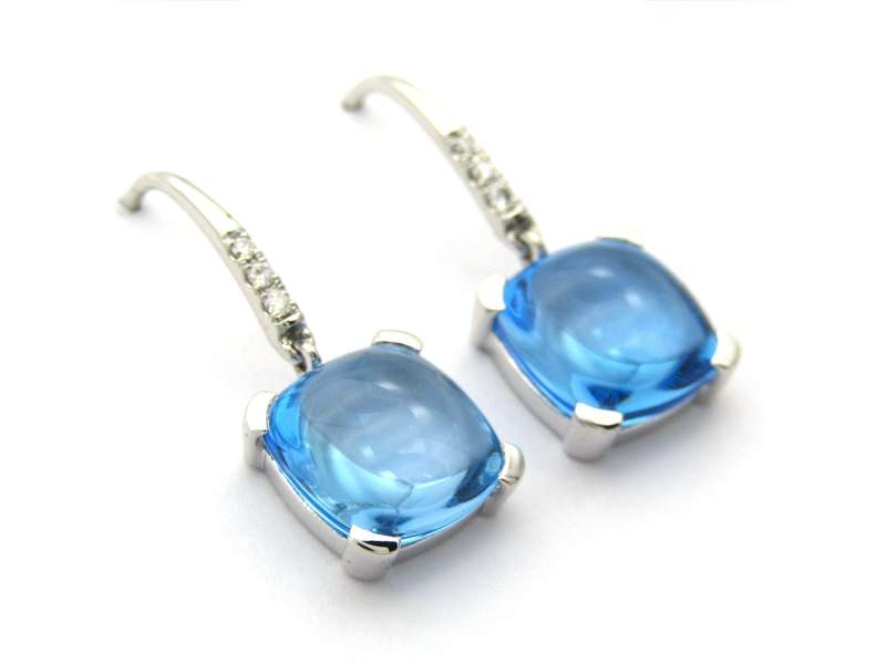 14K gold blue topaz and diamond drop earrings.