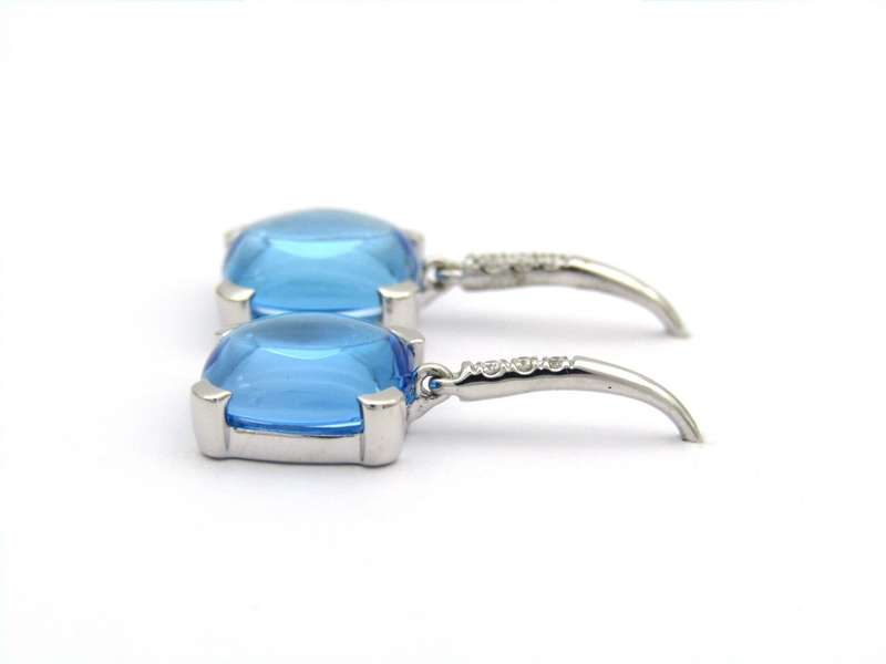 14K gold blue topaz and diamond drop earrings.