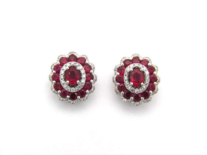 18K gold ruby and diamond earrings.