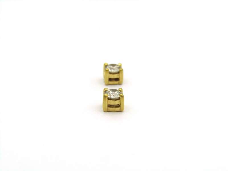 18K gold diamond stud earrings.