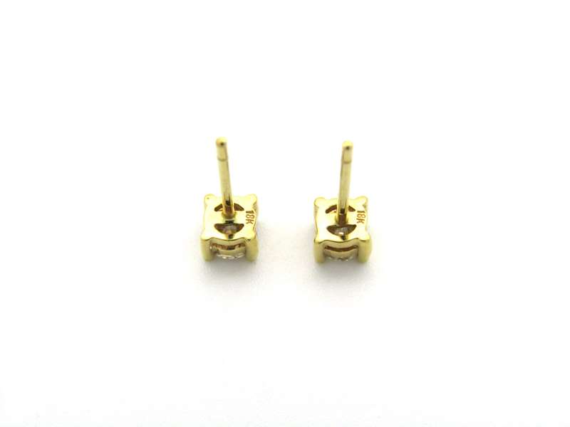 18K gold diamond stud earrings.